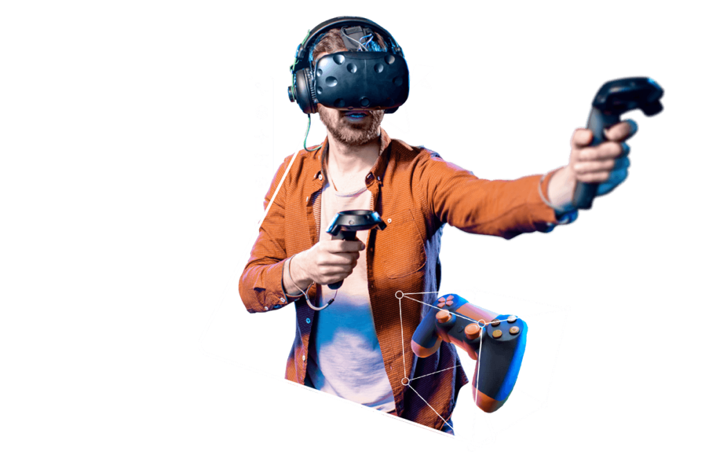 A RMCAD Game Art student holding VR controllers and wearing a headset, 3D modeling a video game controller.