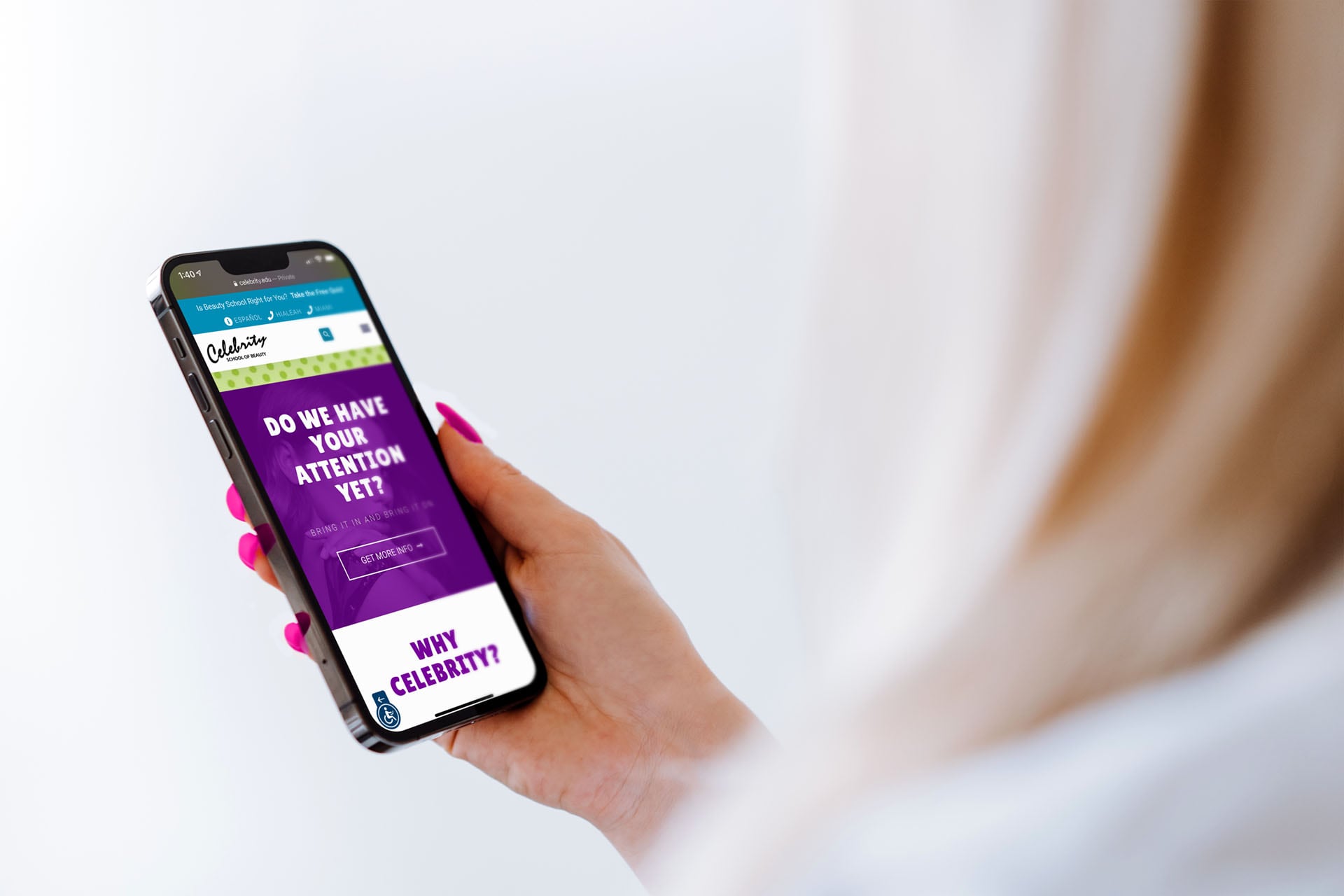 Celebrity School of Beauty website call-to-action section displayed on a mobile phone in a woman's hand.