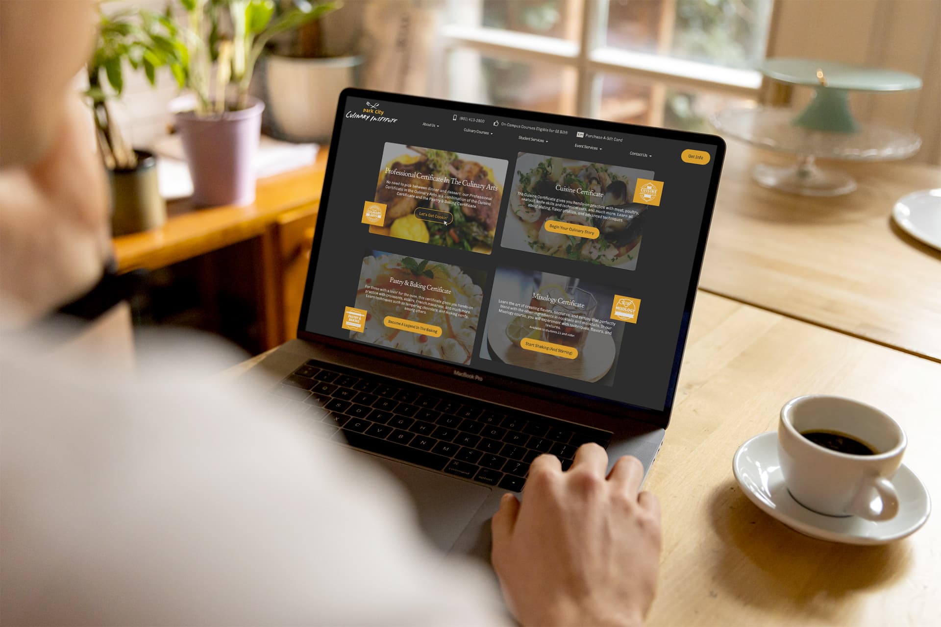 The Park City Culinary Institute homepage's programs section displayed on a laptop in somebody's home.