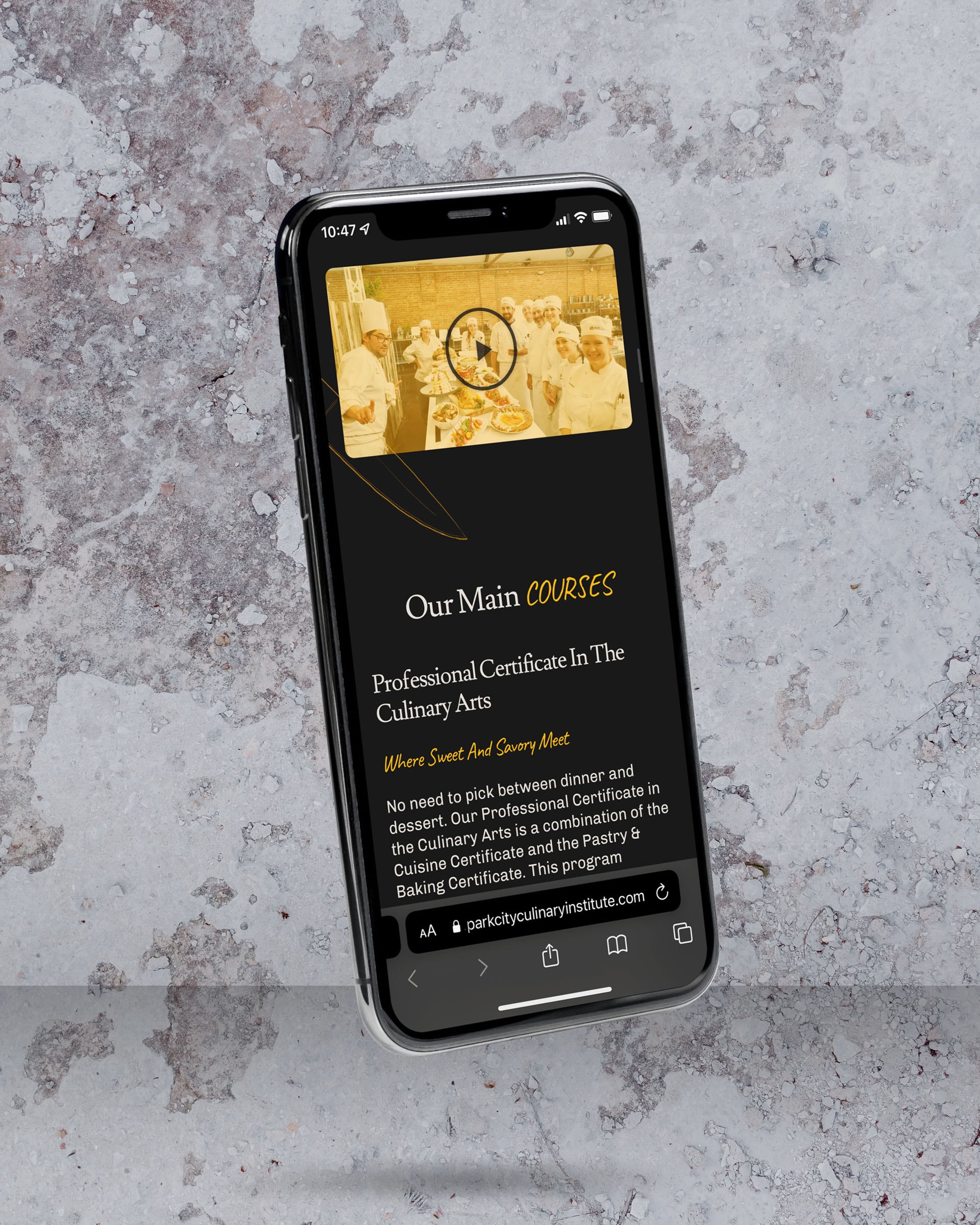 The Park City Culinary Institute homepage video section displayed on a mobile phone.