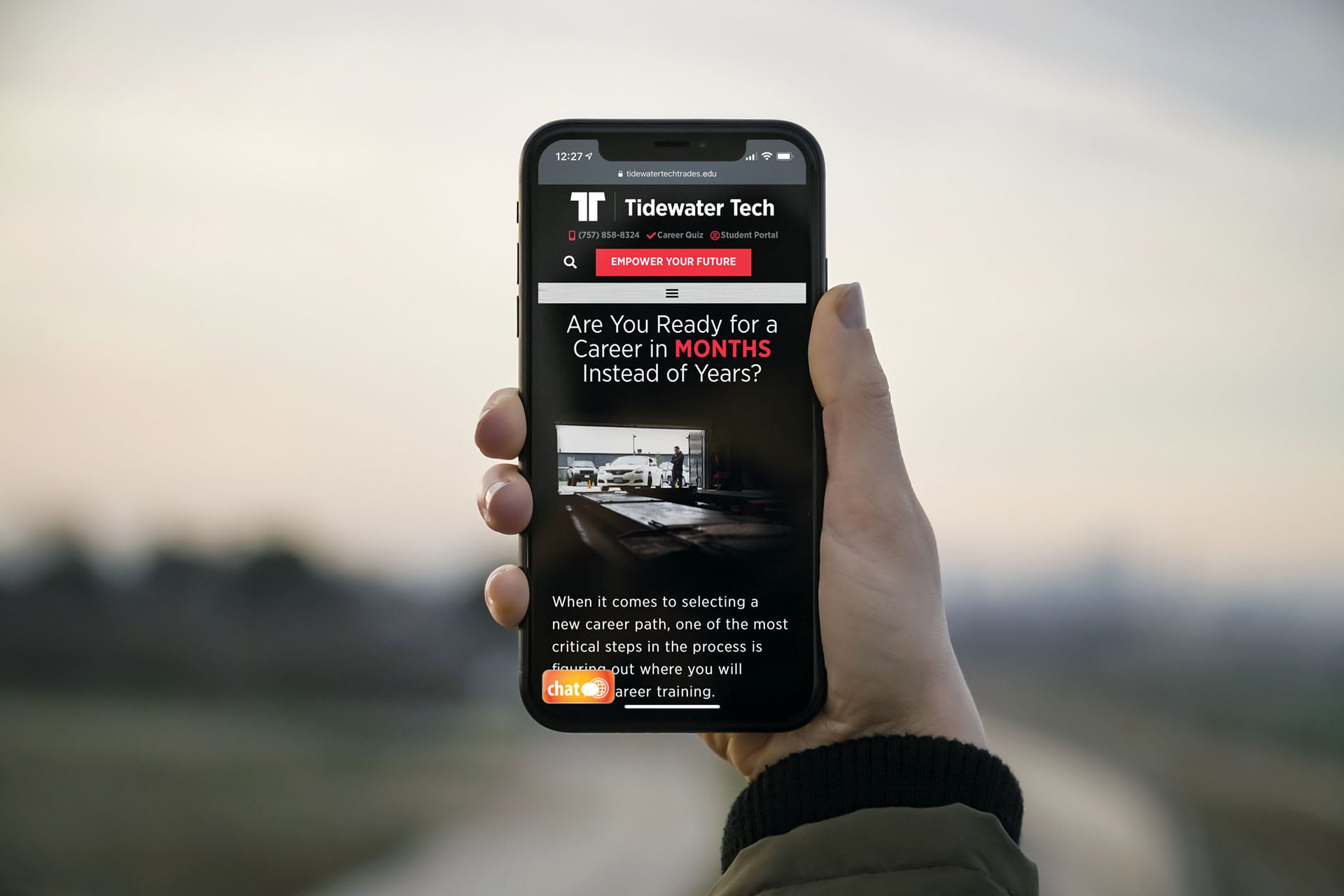 Tidewater Tech automative program page displayed on a phone in somebody's hand.