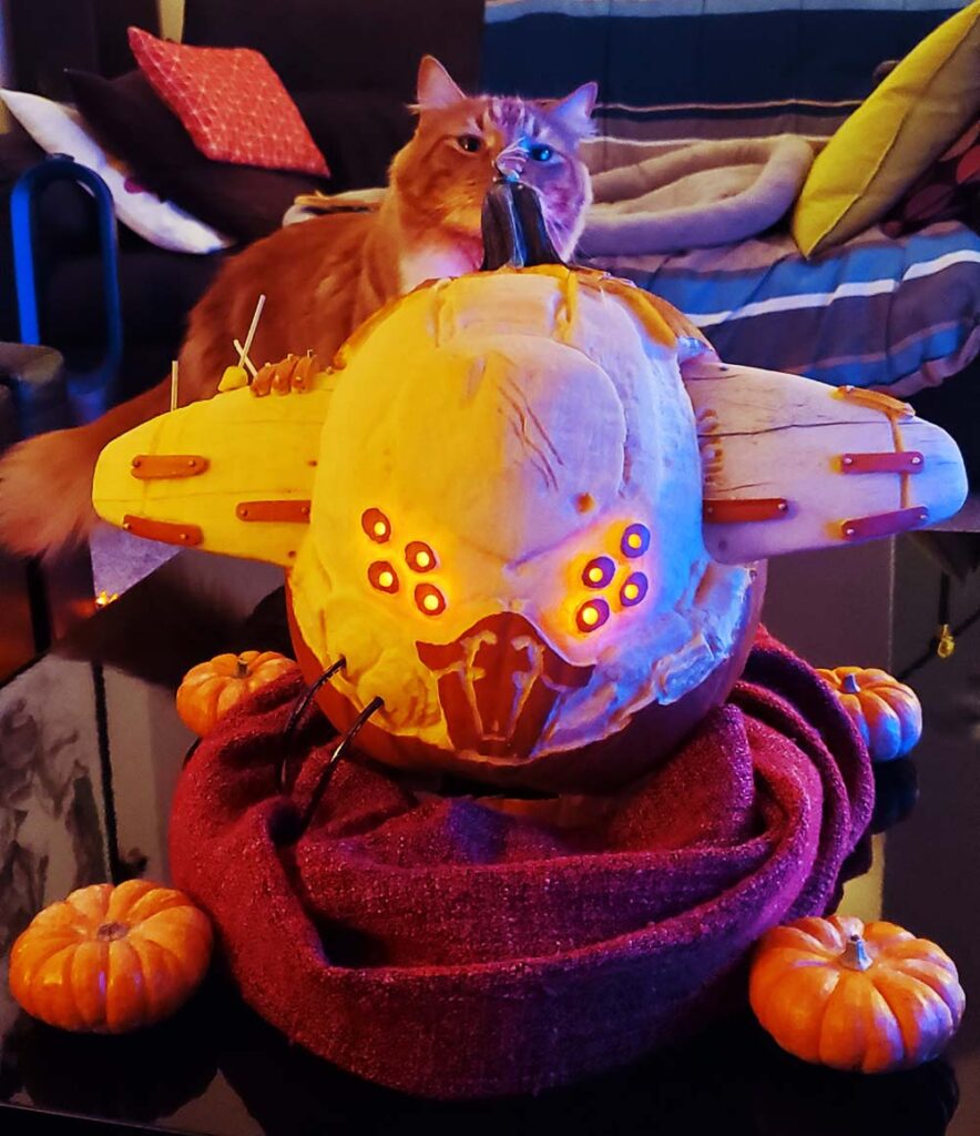 Pumpkin carving of Taniks, the Abomination, boss of the Destiny 2: Beyond Light raid, Deep Stone Crypt. Featuring four miniature pumpkins to imitate Taniks' shank impellor body.