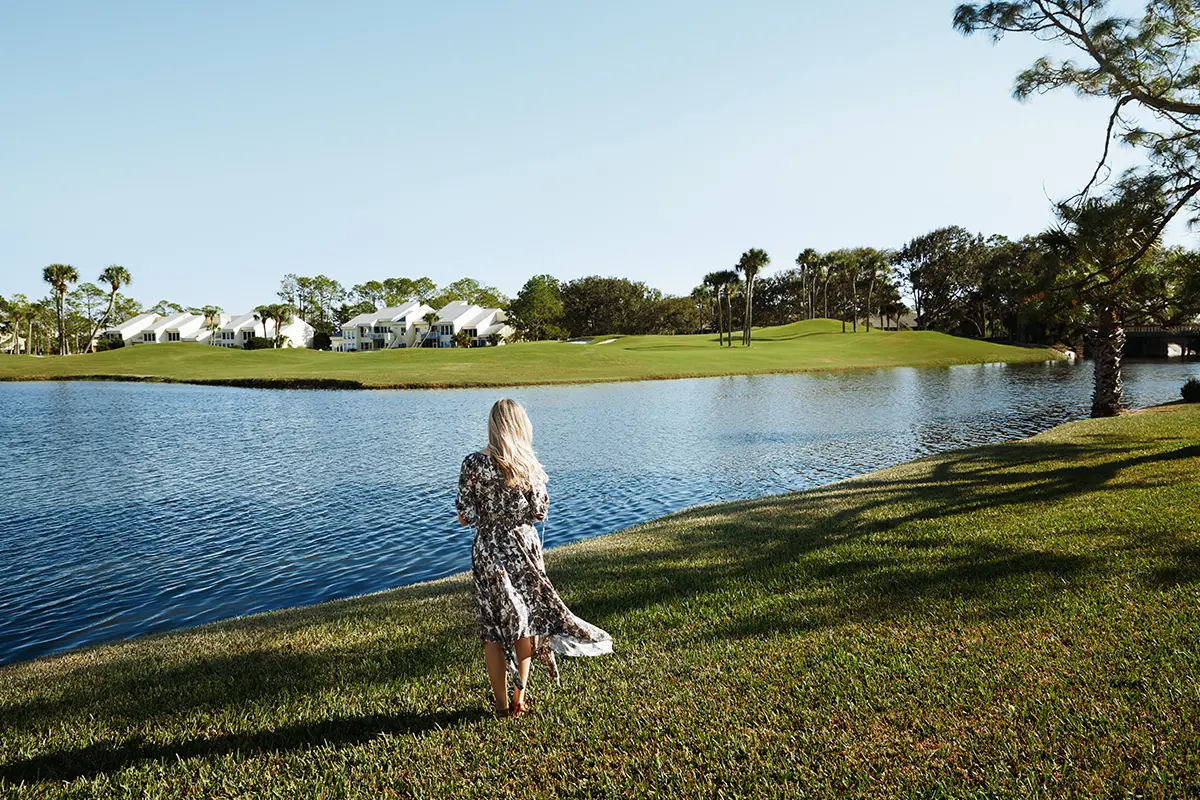 woman-standing-lakefront-southwest-florida