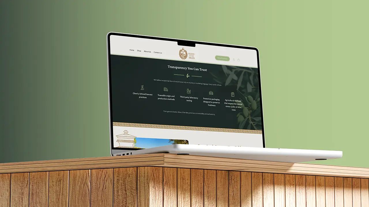 Olive of the Isles website displayed on a laptop, featuring the homepage benefits section.
